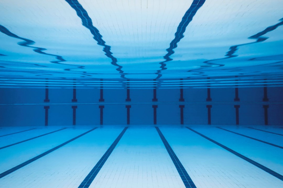 An underwater photo of a commercial swimming pool demonstrating excellent clarity of the water
