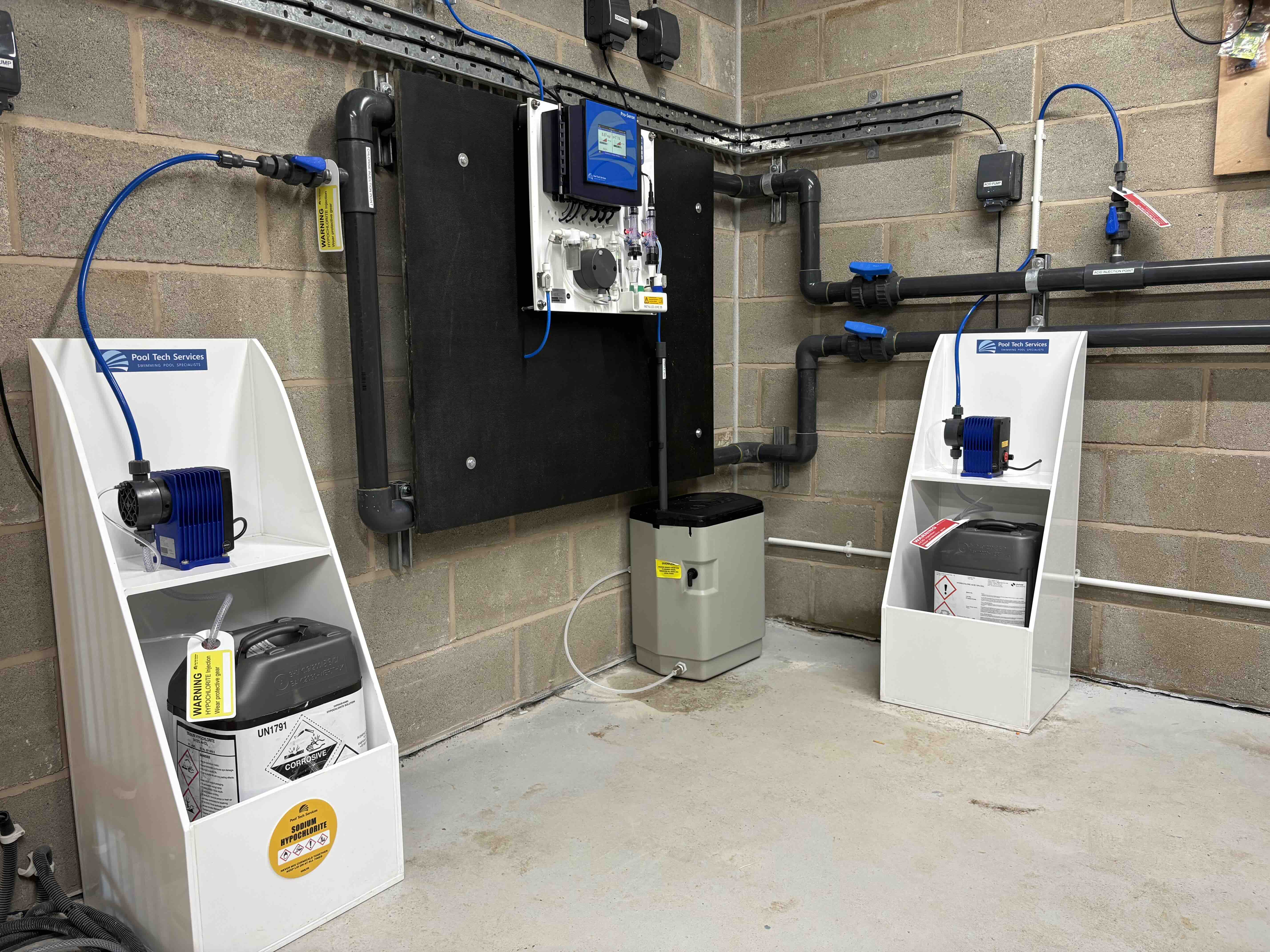 Photo of a pool chemical dosing system